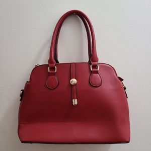 Red faux leather handbag with gold accents